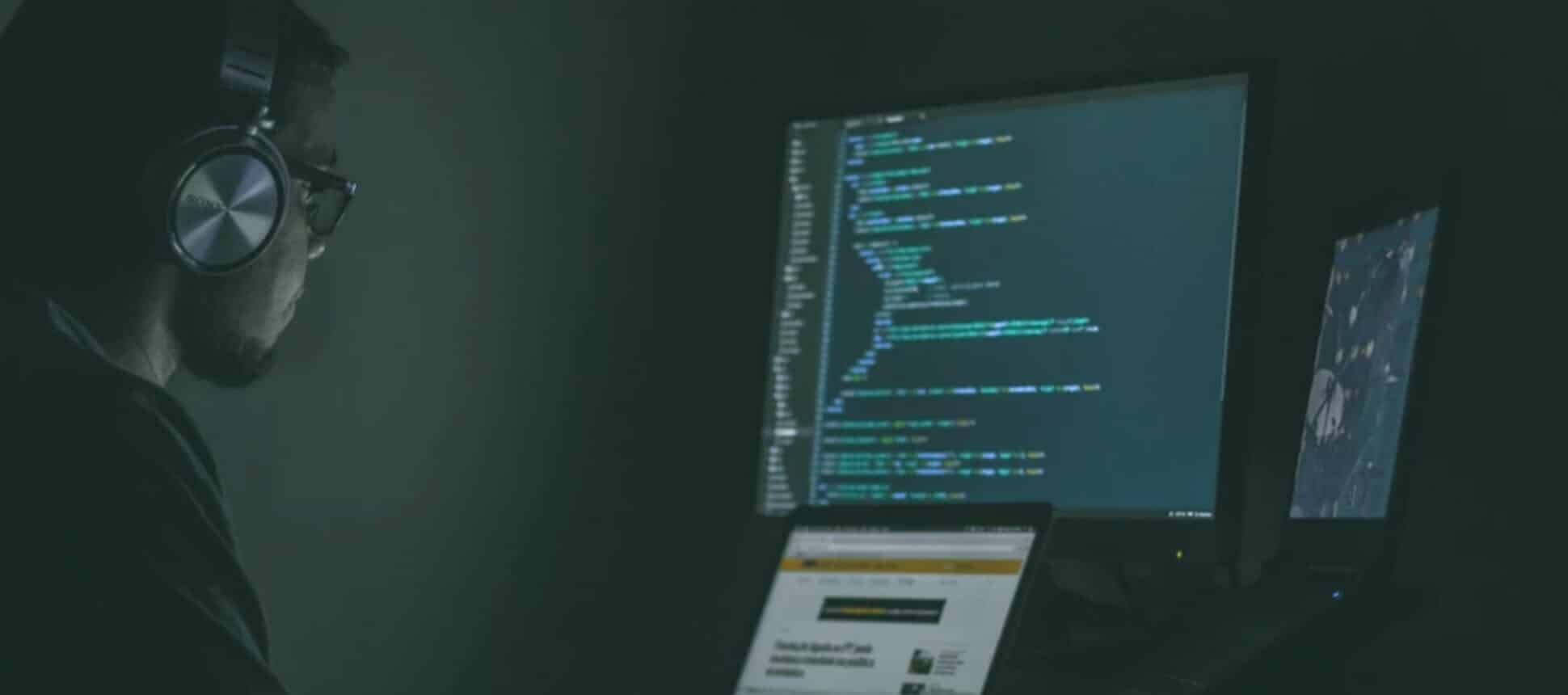 A man coding.