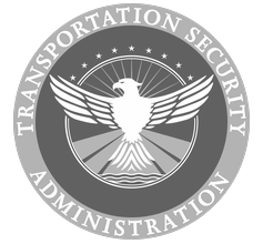 A TSA emblem featuring a bald eagle with outstretched wings inside a circular border.