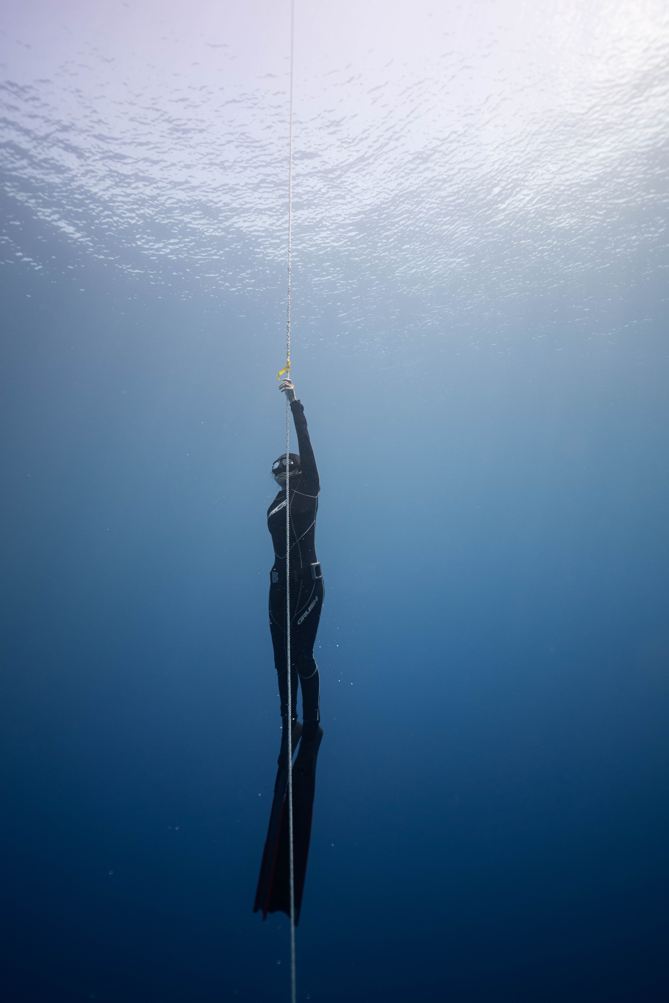 A snorkeler in the deep sea.