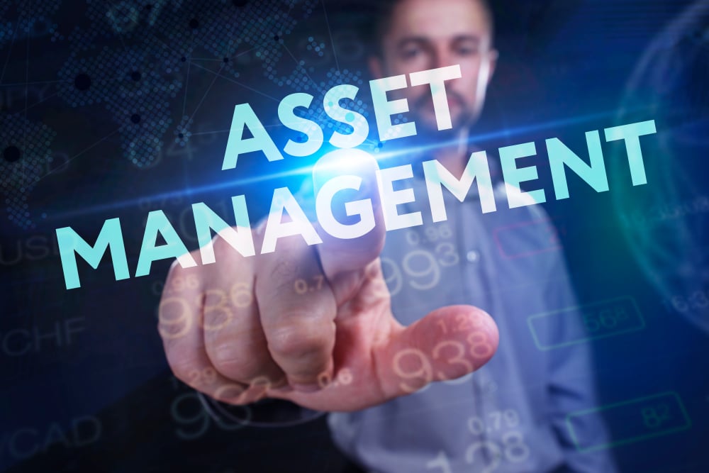 Man pointing at words "Asset Management"